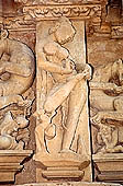 Khajuraho - Jain complex, Parsvanatha temple, the classical image of a sura-sundari young girl that removes a thorn from from the foot  